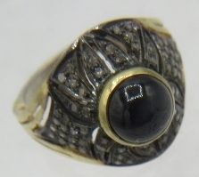 A yellow & white metal ring set with a dark cabochon sapphire and several panels of rose cut - Image 2 of 4