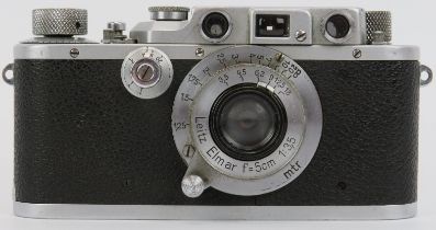 A vintage Leica 111b camera, circa 1938 to 1941. With a Leitz Elmar lens, leather case and manual.