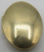 A 9ct yellow gold oval locket. Approx 40mm long, approx weight 7.6 grams. Condition report: Some