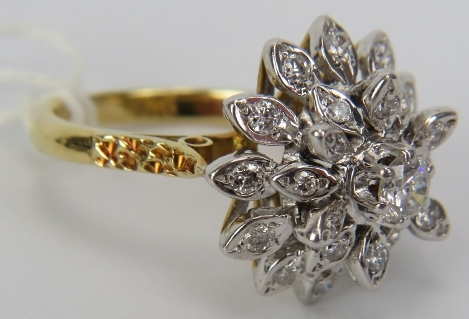 An 18ct yellow & white gold diamond cluster ring. The centre diamond approx 0.25cts with each - Image 2 of 3