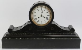 A large Victorian slate and marble mantle clock. The enamelled white dial with black Roman numerals.