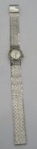 An 18ct white gold ladies Omega wristwatch with gem set dial. Approx weight 44.3 grams. Condition
