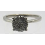 A 9ct white gold diamond cluster ring, size K. Round brilliant cut diamonds approx 0.3cts, approx