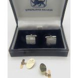 A pair of silver square design cuff links, Birmingham 2003, boxed and a pair of 9ct gold oval