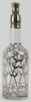 A silver overlaid glass wine bottle, late 19th/early 20th century. 32.8 cm height. Condition report: