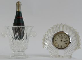 A Waterford novelty crystal champagne bucket of campagna urn form and a bedside clock of scallop