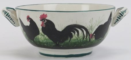 A Wemyss ware twin handled bowl decorated with black hens and cockerels. Signed with impressed