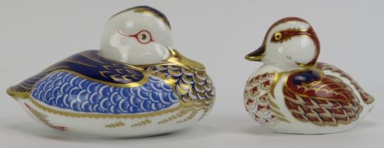 Two Royal Crown Derby porcelain duck paperweight figurines. (2 items) 12 cm length, 7.5 cm length.