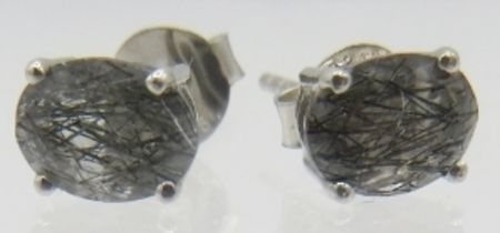 A pair of white metal rutile quartz stud earrings, backs marked 925. Approx weight 1.7 grams.