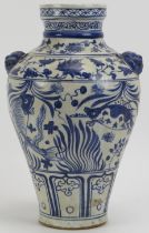 A Chinese Ming dynasty style blue and white porcelain twin handled vase, 20th century. The handles