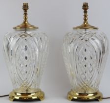 A large pair of Waterford crystal glass gilt metal mounted table lamps. Both with acid etched