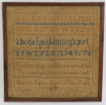 Textiles: A mid Victorian needlework sampler, dated 1857. Framed and glazed. 29 cm x 29 cm.