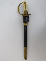 A German forestry hunting cutlass. With an ivory and gilt brass hilt with shell guard, the blade