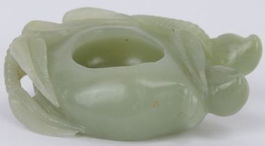 A Chinese pale celadon jade brush washer cup, 20th century. Carved in the form of a simplified lotus