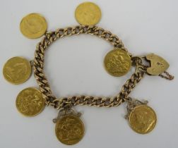 A 9ct yellow gold link bracelet with 9ct gold padlock clasp, having seven Victorian & Edwardian half