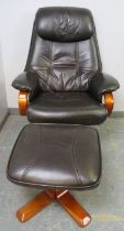 A contemporary reclining and swivel lounge chair upholstered in black leather together with matching