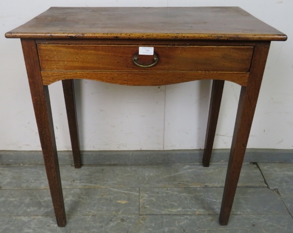 A George III mahogany side table, having one long frieze drawer above shaped apron, on tapering