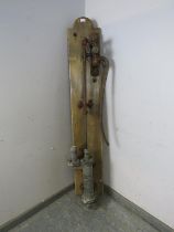 A large Victorian cast iron water pump by J. Tyler & Sons, mounted on an oak board. H170cm W30cm