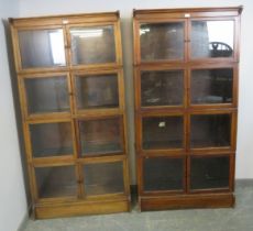 A pair of early 20th century mahogany stacking solicitor’s bookcases, each comprising four