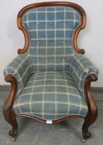 A Victorian mahogany spoonback armchair, reupholstered in blue chequered woollen material, having