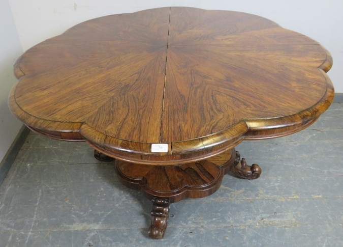 A Victorian rosewood tilt-top breakfast table, the top with lobed edge, on a bulbous octagonal