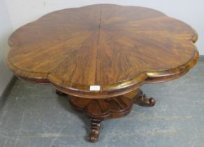 A Victorian rosewood tilt-top breakfast table, the top with lobed edge, on a bulbous octagonal