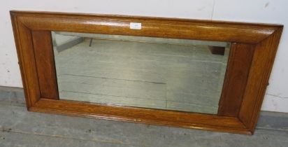 An Art Deco Period bevelled rectangular wall mirror, within a moulded medium oak surround. H44cm