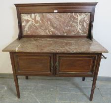 An Edwardian mahogany washstand, parquetry strung and having rouge marble top and splash-back, above