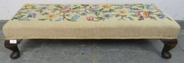 An antique tapestry long footstool, on fruitwood ogee supports. c1920. H23cm W100cm D36cm (