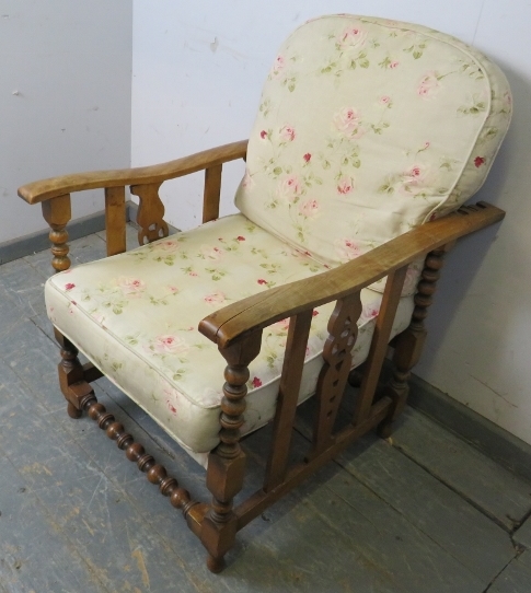 An antique Continental beech and ash wheelback reclining armchair, having carved and pierced sides - Image 2 of 3