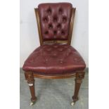 A 19th Century walnut occasional chair, re-upholstered in buttoned burgundy leather with brass