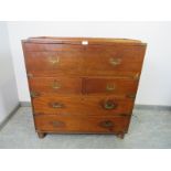 A 19th century camphorwood brass mounted campaign secretaire chest, the fall front opening onto a