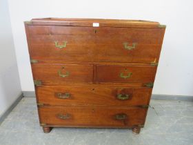 A 19th century camphorwood brass mounted campaign secretaire chest, the fall front opening onto a
