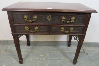 An 18th century mahogany low boy in the Chippendale taste, having one long above two short drawers
