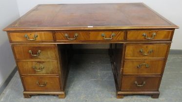 A fine quality Howard & Sons Victorian mahogany partner’s desk, the top with inset brown