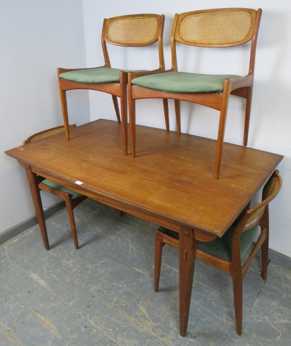 A mid-century Danish teak draw-leaf extending dining table by Kofod Larsen, on tapered supports with - Image 4 of 5