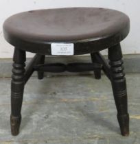 A late 19th century stool, the dished oak top on turned supports with an ‘H’ stretcher. H28cm