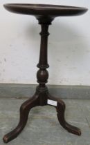 An early 20th century Regency Revival small mahogany wine table, the dished top on a turned pedestal