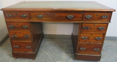 A late Victorian mahogany pedestal desk, the inset green leather writing surface above a