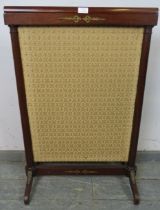 A 19th century mahogany Continental fire-screen, the sliding centre panel trimmed with embroidered