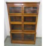 An Edwardian mahogany four-section stacking solicitor’s bookcase, each shelf having twin glazed