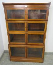 An Edwardian mahogany four-section stacking solicitor’s bookcase, each shelf having twin glazed