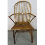 An 18th century ash hoop back Windsor chair of good colour, on turned supports with an ‘H’