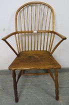 An 18th century ash hoop back Windsor chair of good colour, on turned supports with an ‘H’