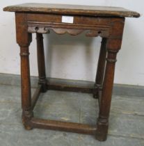 A late 17th/early 18th century oak joint stool, having carved and shaped frieze with the incised
