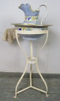 A 19th century metal washstand, with accompanying Copeland jug and bowl, on scrolled tripod supports