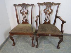 His and Hers Chippendale Revival mahogany chairs, having carved and pierced backs, above drop-in