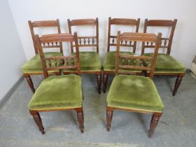 A set of six turn of the century mahogany dining chairs, the reeded backs with fluted spindles,