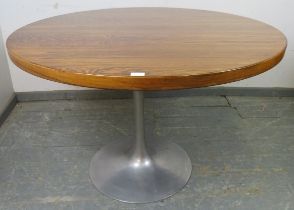 A mid-century tropical hardwood ‘tulip’ circular dining table by Arkana, in the manner of Eero