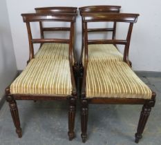 A set of four William IV mahogany dining chairs, having drop-in seat pads upholstered in striped